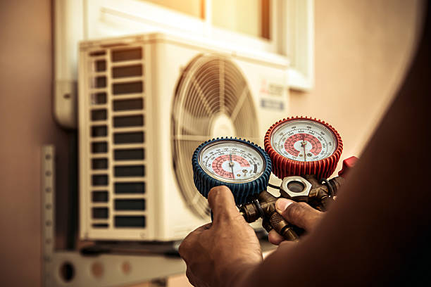 Professional Air Conditioning Service technician working in Mullin, TX